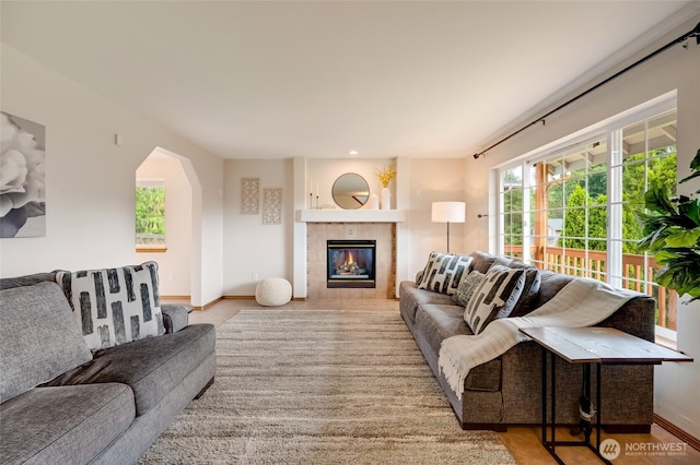 632 97th Ave SE, Lake Stevens, WA 98258 - living room featuring arched walkways and a tile fireplace