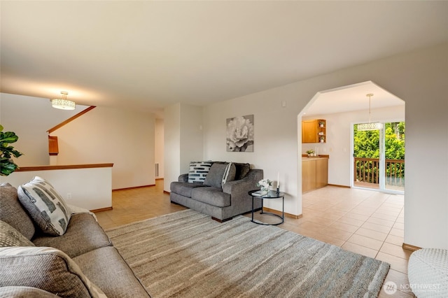 632 97th Ave SE, Lake Stevens, WA 98258 - living area with light tile patterned floors and arched walkways
