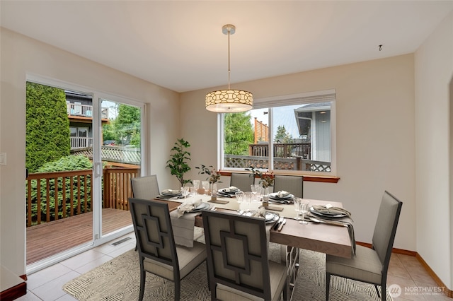 632 97th Ave SE, Lake Stevens, WA 98258 - dining room featuring light tile patterned floors and baseboards