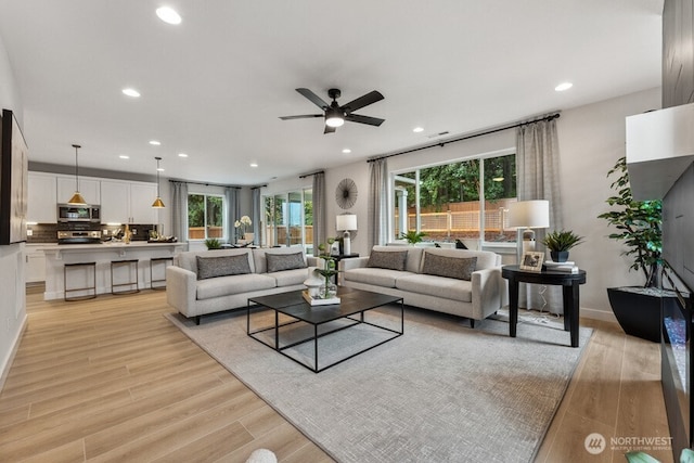 20316 150th St E, Bonney Lake, WA 98391 - living area featuring ceiling fan, recessed lighting, and light wood finished floors