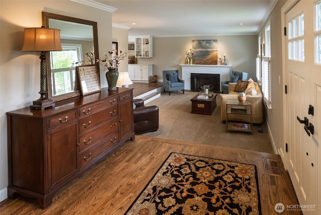 4546 193rd Pl SE, Issaquah, WA 98027 - living area with wood finished floors, crown molding, and a fireplace