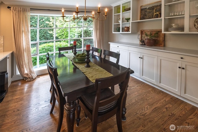 4546 193rd Pl SE, Issaquah, WA 98027 - dining space featuring dark wood-style flooring, a chandelier, and crown molding