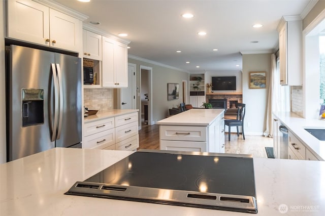 4546 193rd Pl SE, Issaquah, WA 98027 - kitchen featuring stainless steel refrigerator with ice dispenser, crown molding, recessed lighting, tasteful backsplash, and white cabinets