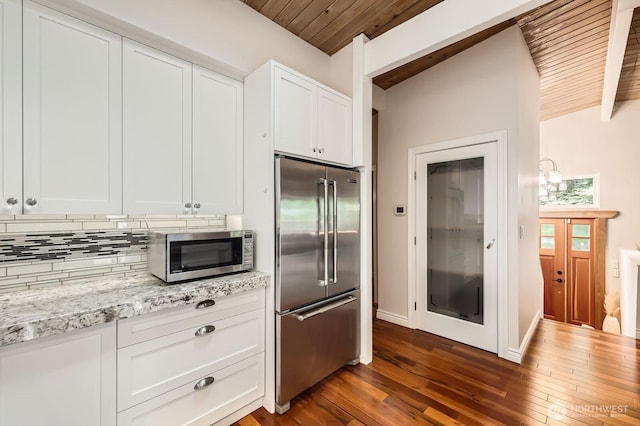 11446 Ohde Ave, Kirkland, WA 98033 - kitchen with stainless steel appliances, wooden ceiling, dark wood-style floors, white cabinets, and light stone counters