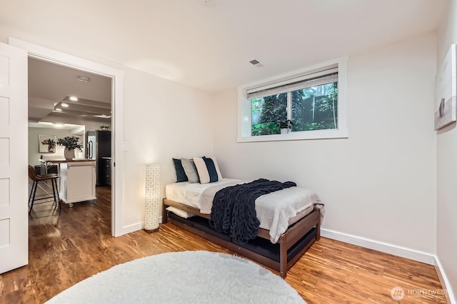 11446 Ohde Ave, Kirkland, WA 98033 - bedroom featuring wood finished floors and freestanding refrigerator