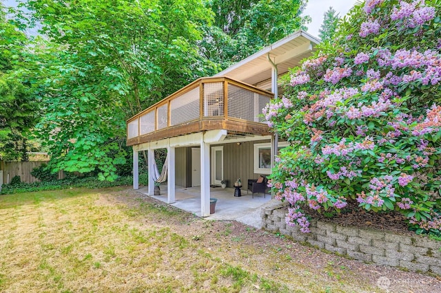 11446 Ohde Ave, Kirkland, WA 98033 - rear view of property with a patio, a wooden deck, and board and batten siding