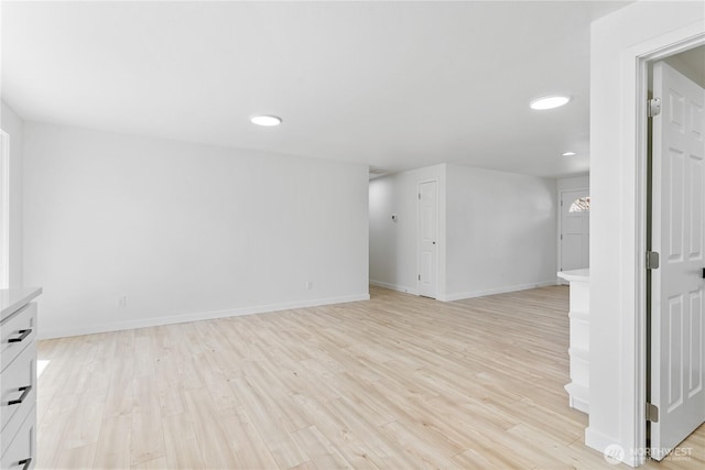 7611 Easy St, Everett, WA 98203 - unfurnished living room with light wood finished floors and recessed lighting