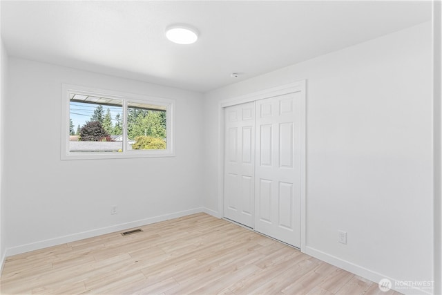 7611 Easy St, Everett, WA 98203 - unfurnished bedroom with light wood finished floors and a closet