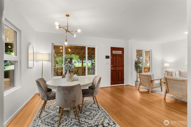 15516 10th Ave NE, Shoreline, WA 98155 - dining area with light wood-style floors and a chandelier