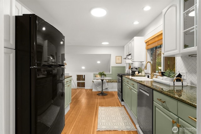15516 10th Ave NE, Shoreline, WA 98155 - kitchen with freestanding refrigerator, stainless steel dishwasher, electric range oven, green cabinetry, and white cabinets