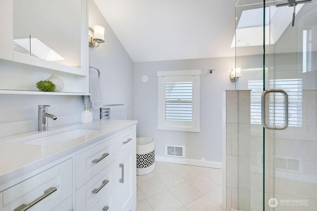 950 Beckett Point Rd, Port Townsend, WA 98368 - full bathroom with lofted ceiling, a stall shower, vanity, and tile patterned floors