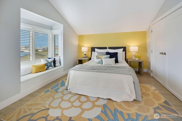 950 Beckett Point Rd, Port Townsend, WA 98368 - bedroom featuring vaulted ceiling, wood finished floors, and a closet