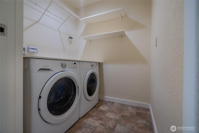 12617 NE 130th Way Unit E303, Kirkland, WA 98034 - laundry area featuring washer and dryer and stone finish floors