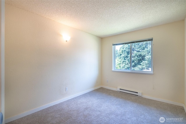 12617 NE 130th Way Unit E303, Kirkland, WA 98034 - carpeted empty room featuring baseboard heating and a textured ceiling