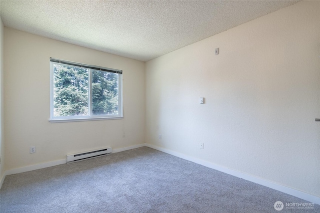 12617 NE 130th Way Unit E303, Kirkland, WA 98034 - spare room featuring a baseboard radiator, carpet flooring, and a textured ceiling