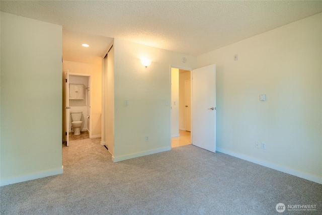 12617 NE 130th Way Unit E303, Kirkland, WA 98034 - unfurnished bedroom featuring carpet flooring and recessed lighting