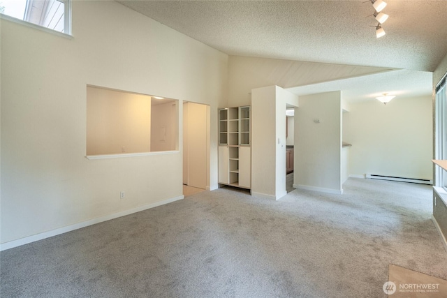12617 NE 130th Way Unit E303, Kirkland, WA 98034 - carpeted spare room with a baseboard radiator, a textured ceiling, and high vaulted ceiling