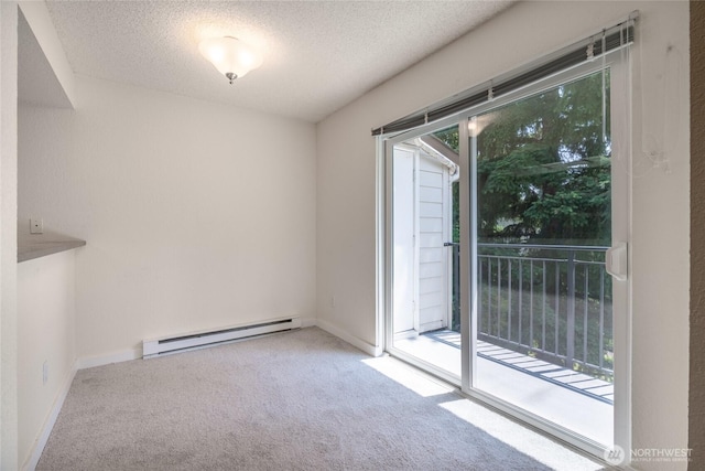 12617 NE 130th Way Unit E303, Kirkland, WA 98034 - carpeted empty room featuring a baseboard heating unit and a textured ceiling