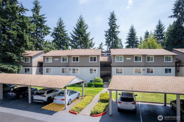 12617 NE 130th Way Unit E303, Kirkland, WA 98034 - view of property with covered and uncovered parking and a residential view