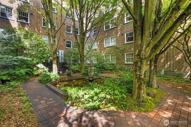 1631 16th Ave Unit 114, Seattle, WA 98122 - surrounding community with a garden pond