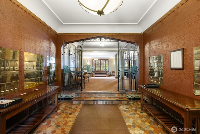 1631 16th Ave Unit 114, Seattle, WA 98122 - foyer featuring a chandelier, a textured wall, and arched walkways