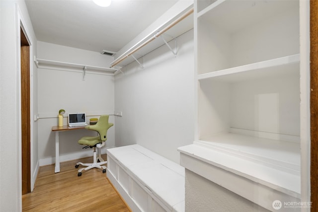 1631 16th Ave Unit 114, Seattle, WA 98122 - walk in closet featuring light wood-type flooring