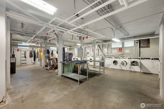 1631 16th Ave Unit 114, Seattle, WA 98122 - garage featuring washing machine and clothes dryer