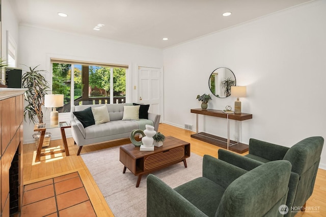 4754 46th Ave NE, Seattle, WA 98105 - living room featuring light wood-type flooring, recessed lighting, and crown molding