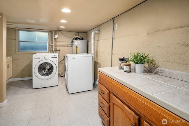 4754 46th Ave NE, Seattle, WA 98105 - laundry room featuring water heater, washing machine and clothes dryer, light tile patterned floors, cabinet space, and recessed lighting