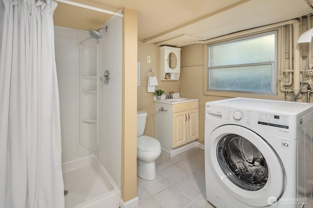 4754 46th Ave NE, Seattle, WA 98105 - bathroom featuring washer / clothes dryer, tile patterned flooring, a shower with curtain, and vanity