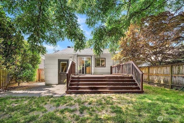 4754 46th Ave NE, Seattle, WA 98105 - back of property with a fenced backyard and a deck