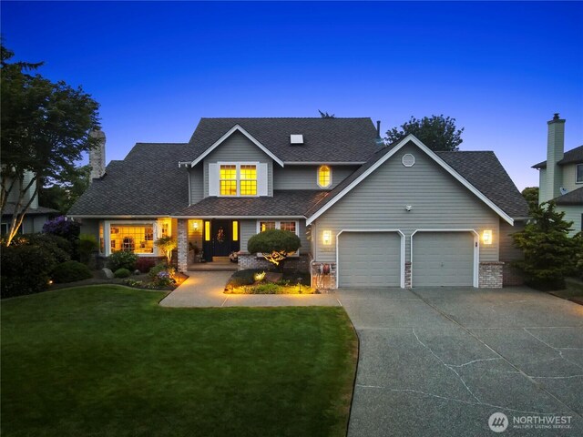 2601 59th St SW, Everett, WA 98203 - traditional home with a garage, concrete driveway, a yard, a porch, and a shingled roof