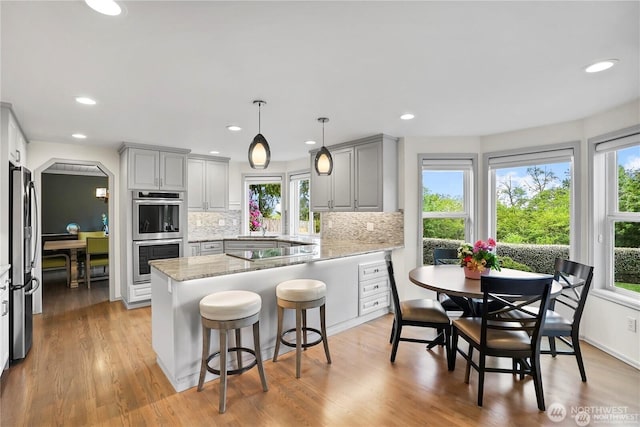 2601 59th St SW, Everett, WA 98203 - kitchen featuring appliances with stainless steel finishes, gray cabinets, healthy amount of natural light, and recessed lighting