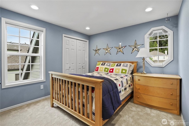 2601 59th St SW, Everett, WA 98203 - bedroom with light colored carpet, a closet, and recessed lighting