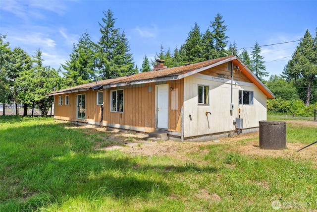 1608 State Route 6, Raymond, WA 98577 - view of front of house with a chimney, a front lawn, and entry steps