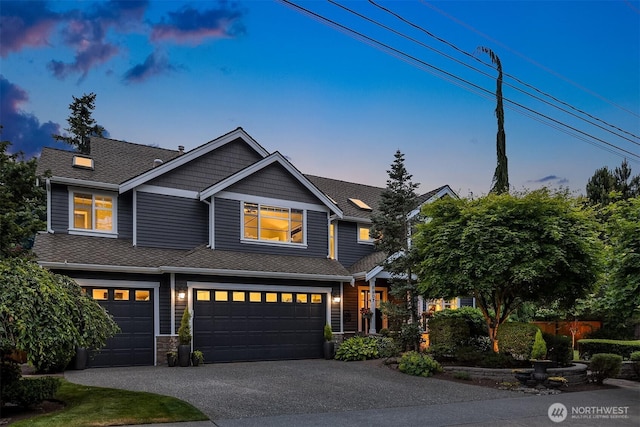8907 NE 152nd Pl, Bothell, WA 98011 - view of front of property featuring a garage, driveway, stone siding, and roof with shingles