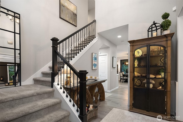 8907 NE 152nd Pl, Bothell, WA 98011 - stairs with a high ceiling and wood finished floors