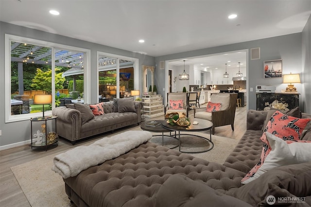 8907 NE 152nd Pl, Bothell, WA 98011 - living room with light wood-style floors and recessed lighting