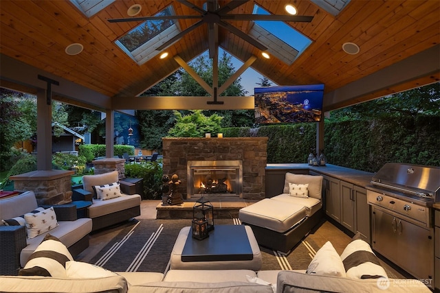 8907 NE 152nd Pl, Bothell, WA 98011 - view of patio with an outdoor living space with a fireplace, a gazebo, and an outdoor kitchen