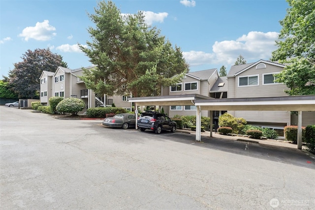 10004 100th Ave NE Unit K202, Kirkland, WA 98034 - partially covered parking lot featuring a residential view