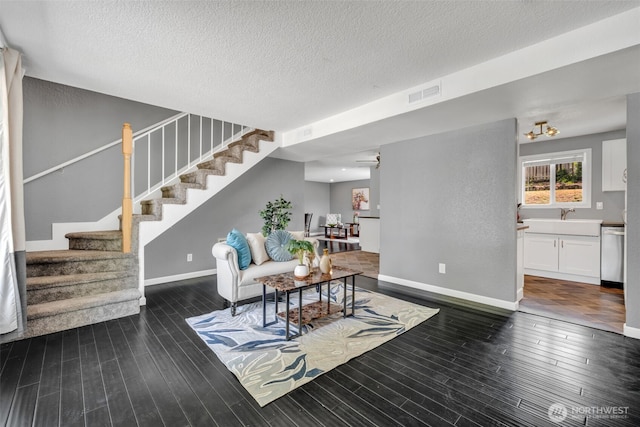 16318 128th Pl SE, Renton, WA 98058 - living room with stairs, wood finished floors, and a textured ceiling