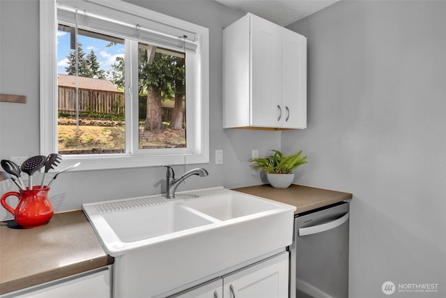 16318 128th Pl SE, Renton, WA 98058 - kitchen with stainless steel dishwasher and white cabinetry