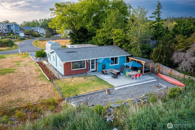 4452 Saltspring Dr, Ferndale, WA 98248 - back of house featuring an outdoor hangout area, a shingled roof, a patio area, and a fenced backyard