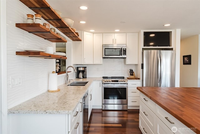 4452 Saltspring Dr, Ferndale, WA 98248 - kitchen featuring open shelves, stainless steel appliances, butcher block counters, recessed lighting, and backsplash