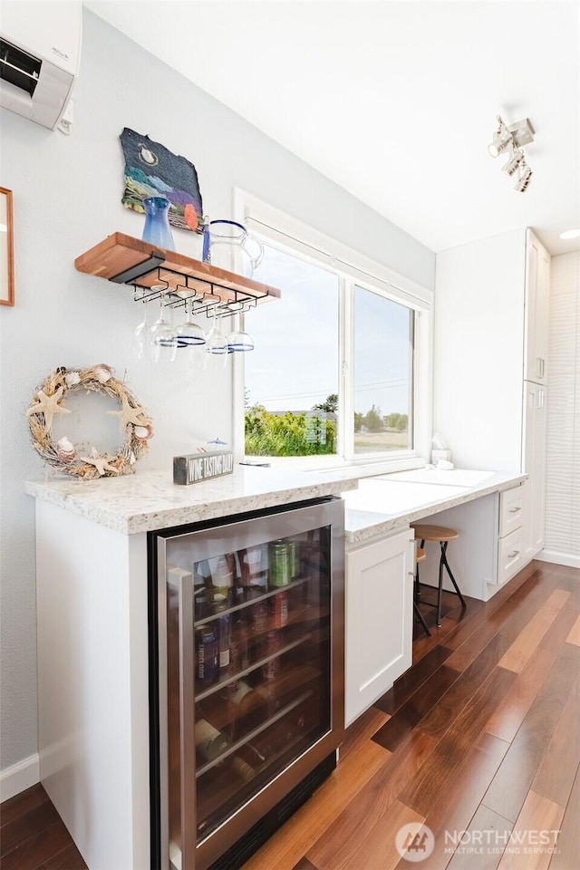 4452 Saltspring Dr, Ferndale, WA 98248 - indoor dry bar featuring beverage cooler, a wall mounted AC, and wood finished floors