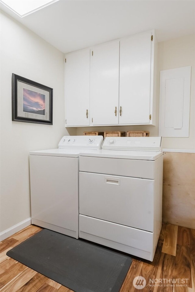 4452 Saltspring Dr, Ferndale, WA 98248 - laundry area featuring separate washer and dryer, light wood-style floors, and cabinet space
