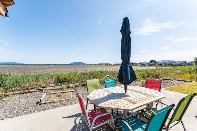 4452 Saltspring Dr, Ferndale, WA 98248 - view of patio with outdoor dining space, a mountain view, and a view of rural / pastoral area