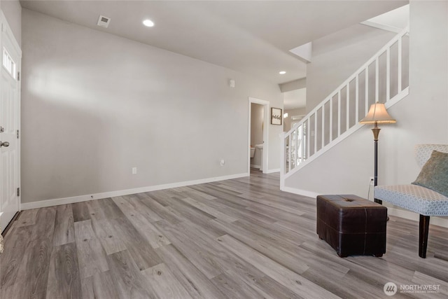 803 Loves Hill Dr, Sultan, WA 98294 - unfurnished living room featuring stairs, wood finished floors, and recessed lighting