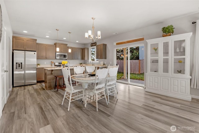 803 Loves Hill Dr, Sultan, WA 98294 - dining room with recessed lighting, light wood-type flooring, and a chandelier