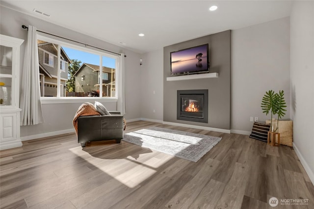 803 Loves Hill Dr, Sultan, WA 98294 - living area with wood finished floors, a large fireplace, and recessed lighting